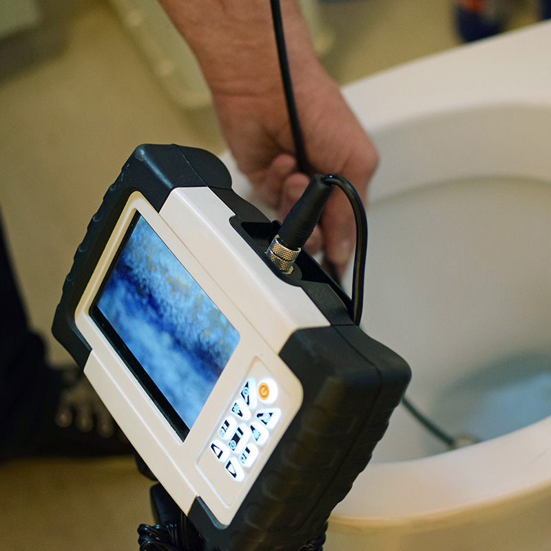 plumber doing sewer line camera inspection through bathroom toilet dallas tx